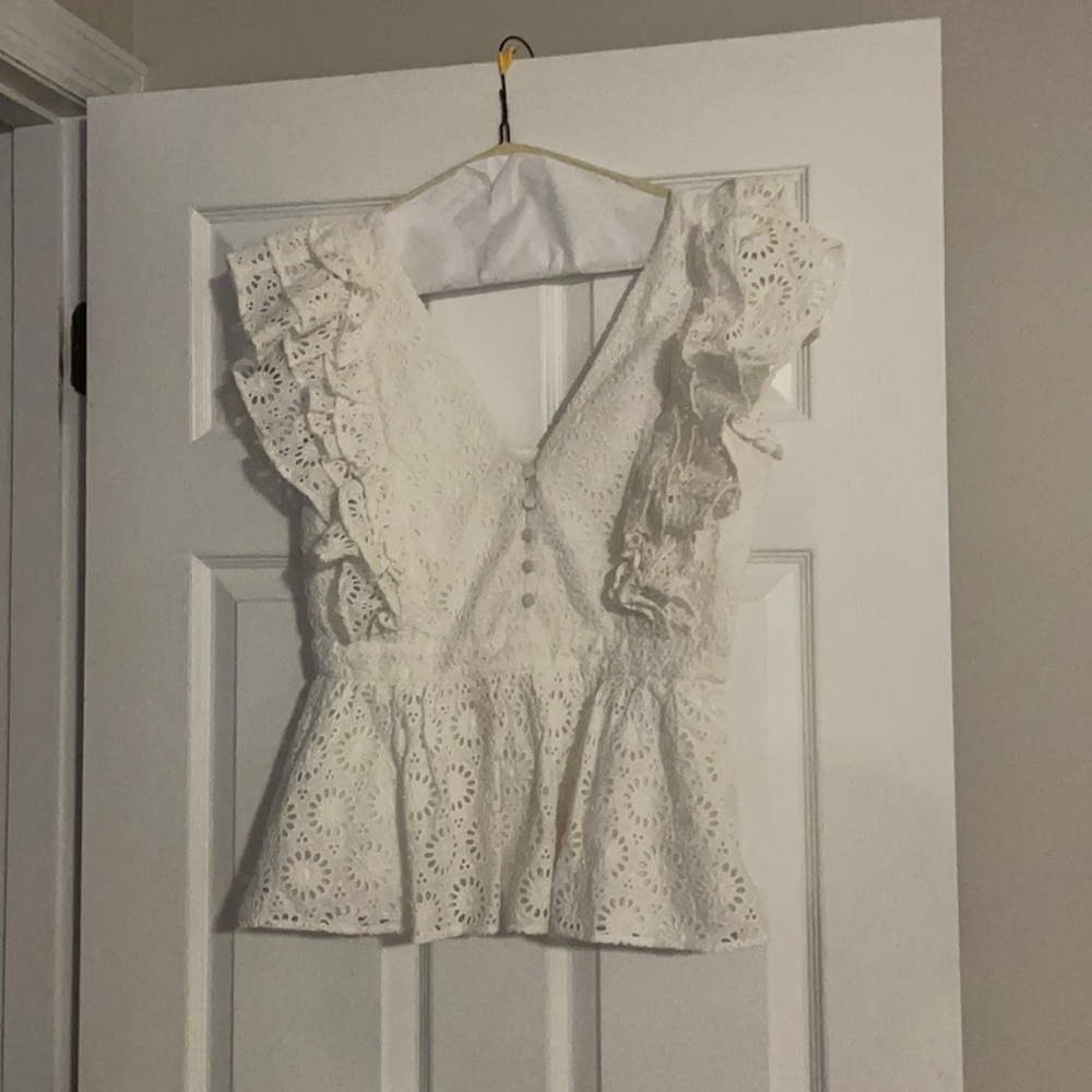 White ruffled top